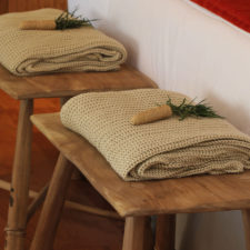 Native wood handmade benches with woven shawls, great attention to detail.