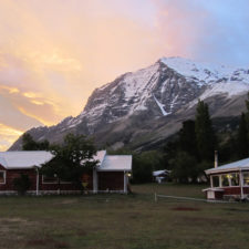Partial view of the Don Snowy Mountain Hotel behind them at sunrise.