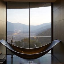 Modern lines tub with city view. Modern and elegant bathroom.