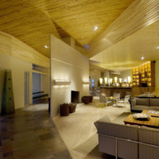 Interior view of the hotel waiting room. Angled wooden ceilings.