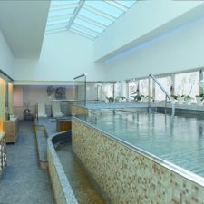 Indoor pool with mozaic details. Glass dome ceilings.