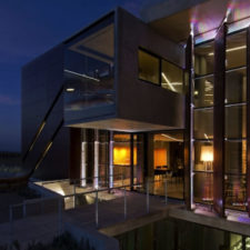 Night sky with beautiful glass and wood windows. modern and natural architecture.