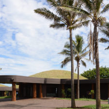 View of the hotel and its curved grass roof architecture.