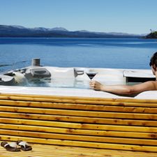 Jacuzzi with hydromassage on outdoor deck-terrace steps from the lake.