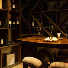Wine cellar with a tasting table for four people. Cheese and wine table in a cozy atmosphere.