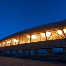 Panoramic view of the exterior of the hotel illuminated at dusk